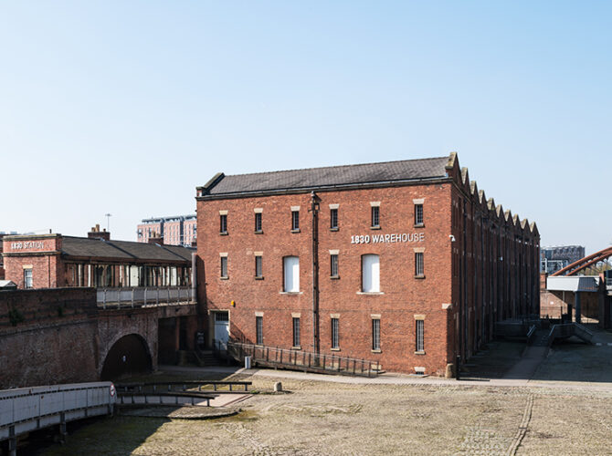 The full length of the warehouse seen from the upper yard, showing its scale and close relationship with Liverpool Road Station.