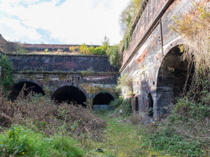 View of the overgrown cutting and brick arches of the Edge Hill Engine Station structures.