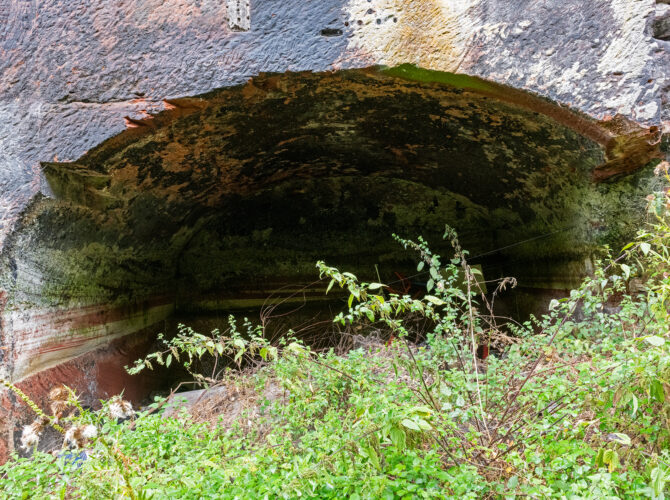 Interior view of a deep brick arch within the engine station structure.