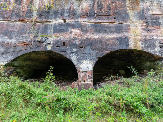 Pair of low arches in the sandstone wall at Edge Hill Engine Station.