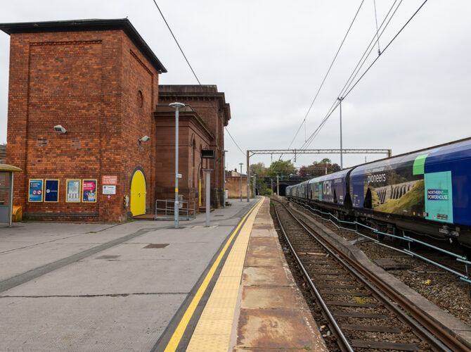 Brick-built hydraulic plant house and tall accumulator tower alongside the platform, once used to power the stationary engines and railway systems.