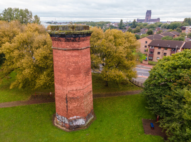 Aerial view of Crown Street ventilation tower with Liverpool Cathedral visible in the distance and surrounding neighbourhood.