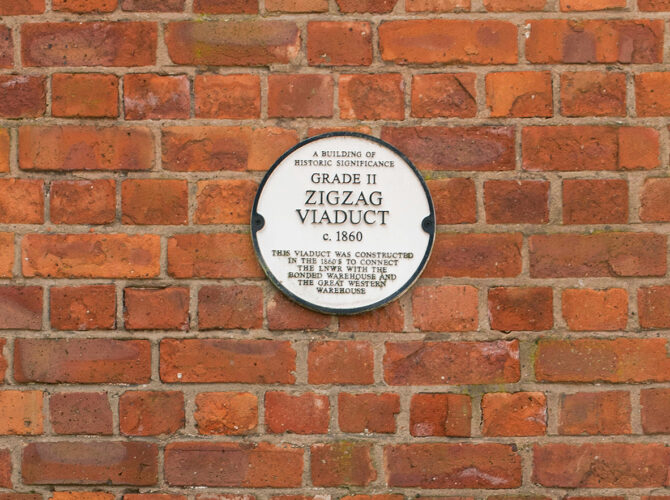 Heritage plaque identifying the Zigzag Viaduct linked to the viaduct and warehouse connection.