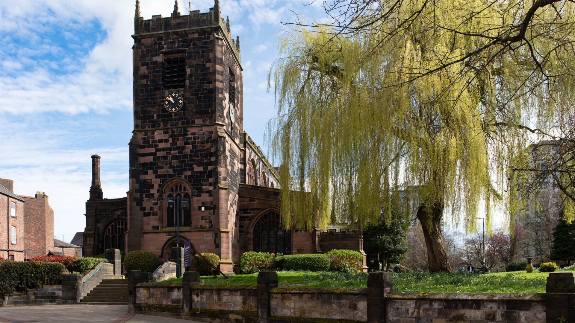 Wider view of the churchyard, showing the setting of Stephenson’s grave within peaceful grounds.