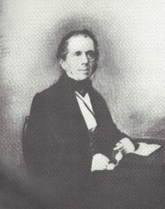 Henry Booth Young man sitting down dressed in victorian clothing