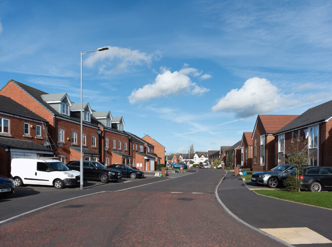A quiet suburban street of recently built houses on land once occupied by locomotive workshops.