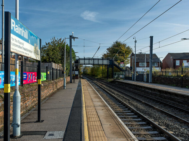 Rainhill station with signage marking the site of the Rainhill Locomotive Trials.