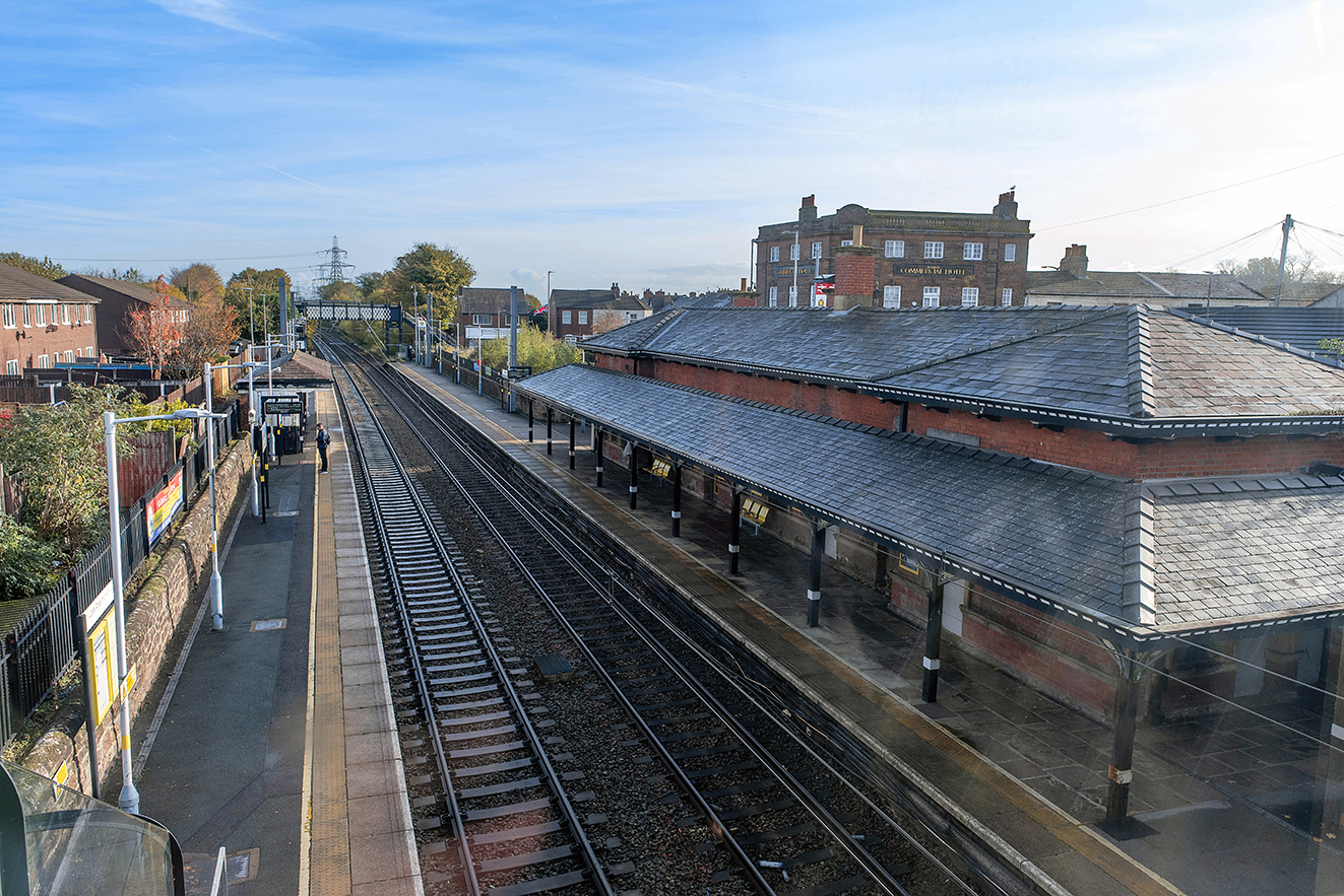 View from above showing the full layout of platforms, tracks, and station buildings.