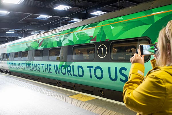 A train wrapped in green promoting climate change