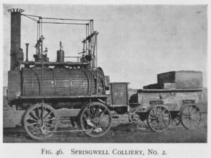 Image of the a old stream train and carriage in blck and while