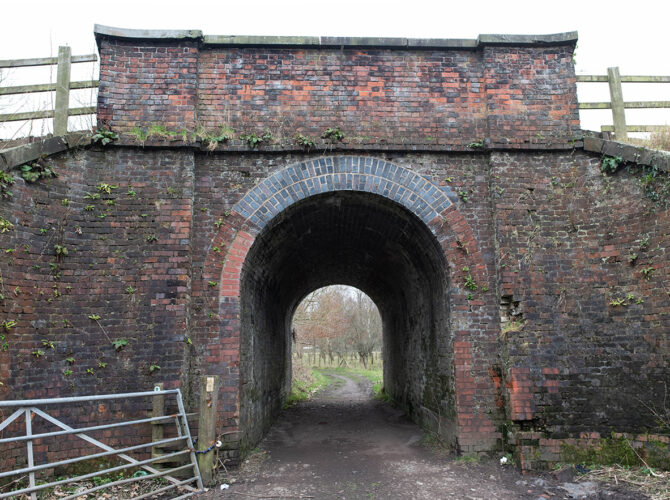 The bridge seen from an angle, showing its sturdy brick construction and the passage beneath.