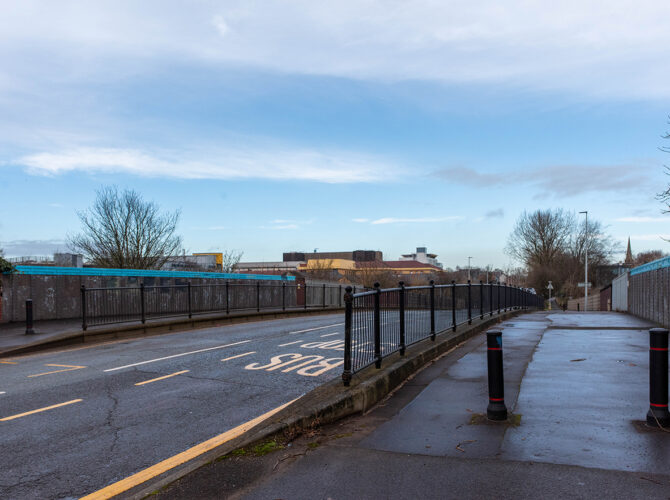 Wider view across the bridge highlighting road markings and surrounding area.