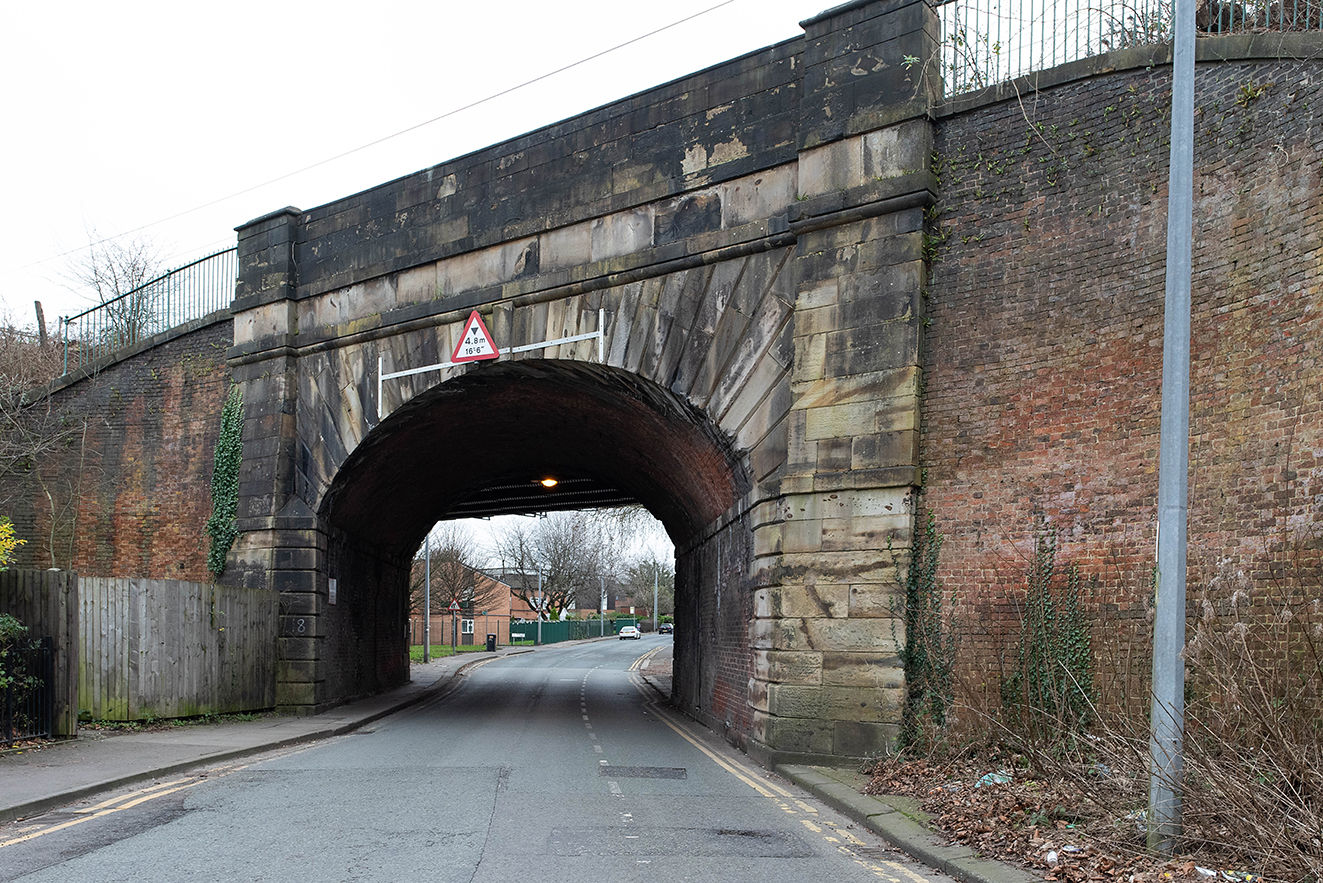 The earlier stone-built arch, with its angled design, shows the craftsmanship of early railway engineering.